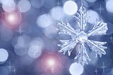 Glass snowflake against blurred background