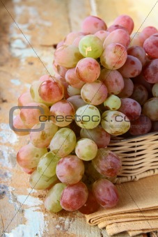 fresh raw red grape on wooden table