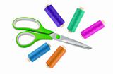 Green metal scissor and colorful sewing threads isolated on whit