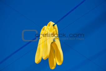 cloth pegs under the clear blue sky