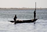 Fishermen in a pirogue in the river Niger.