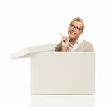 Attractive Female with Pencil Popping Out and Thinking Outside The Box Isolated on a White Background.