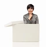 Attractive Ethnic Female Popping Out and Thinking Outside The Box Isolated on a White Background.