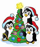 Three penguins with Christmas tree