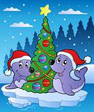 Two seals with Christmas tree