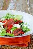 salad with quail eggs and salami