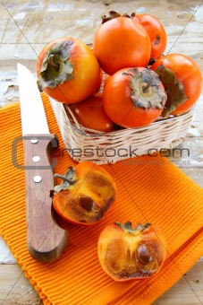 persimmon fruit on wooden table