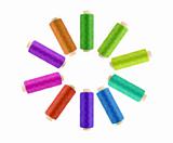 Multicolor sewing threads on white background