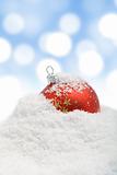 Christmas bauble in snow