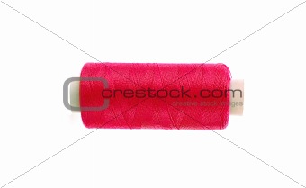 red thread bobbin isolated on white background