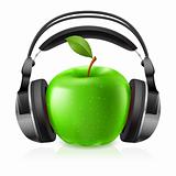 Realistic headphones and green apple