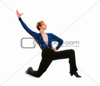 Ballroom male dancer posing on one knee on white background 
