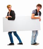 Two teenagers holding blank billboard. Isolated on white

