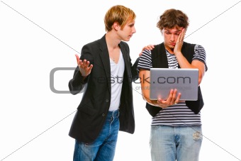 Young man calms his looking in laptop friends. Isolated on white
