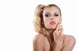 Blond girl with creative make up posing and looking towards the 