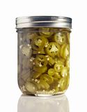 Sliced Jalapenos (Capsicum Annuum) in a Glass Jar on White