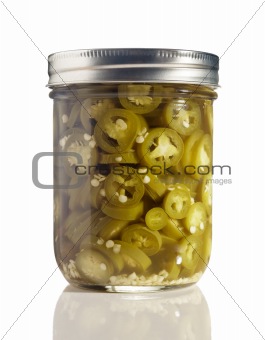 Sliced Jalapenos (Capsicum Annuum) in a Glass Jar on White