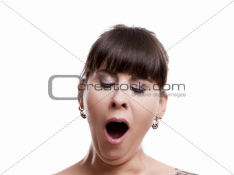 Close-up portrait of a sleepy woman yawn, isolated on white background