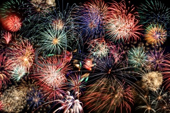 Multicolored fireworks fill the frame