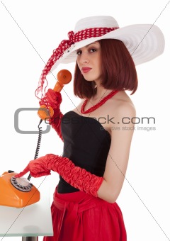 Fashion girl in retro style with vintage phone