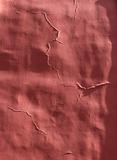 Cracked red plaster wall