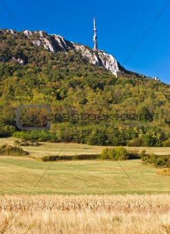 TV tower above beautiful cliffs, forrest & fields
