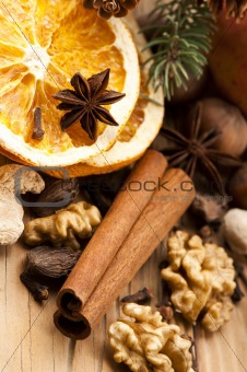 Different kinds of spices, nuts and dried oranges - christmas decoration
