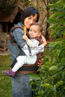 Mother with baby in sling