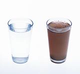 Clean and dirty water in drinking glass - concept