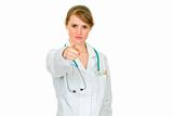 Attractive medical female doctor pointing in camera
