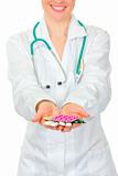 Closeup on pills on medical doctor woman hands
