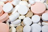 Many colorful medical pills and vitamins as a background