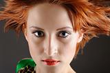 Beauty portrait of pretty woman with healthy red flying hair