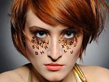 Beautiful red heaired woman portrait with creative  make-up