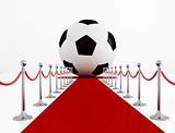 Soccer ball on the red carpet