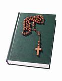 wooden rosary on the Bible