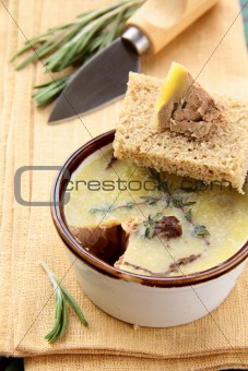 Homemade chicken liver pate on a piece of bread