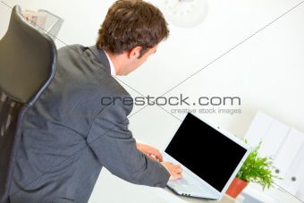 Modern businessman working on laptop
