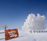 Rusty metallic sign indicating north pole