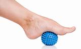 Woman's foot with massage ball