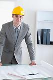 Standing architect with helmet on