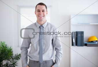 Businessman smiling and standing