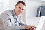 Close up of businessman typing on his laptop
