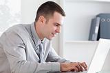 Close up of businessman writing an email with his laptop