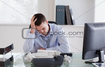 Businessman frustrated by paperwork