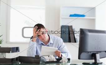 Businessman worried about invoice