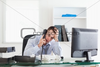 Businessman trying to solve a problem on the phone