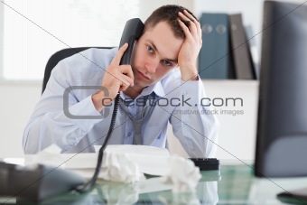 Close up of frustrated businessman on the phone