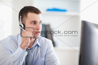Call center agent speaking with costumer