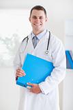 Smiling doctor with folder